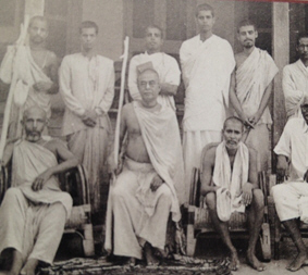 A group of Gaudiya Math sannyasis and brahmacaris of Bhaktisiddhanta Sarasvati Thakura's mission, gathered together in an early photograph