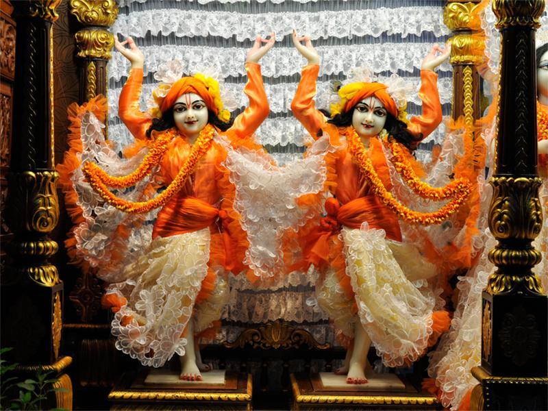 Deities of Sri Sri Gaura-Nityananda in dancing pose, illustrating the two Lords whose sankirtana mission Gadadhara Dasa served in Bengal.