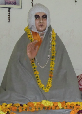 A statue of Srila Jiva Goswami inside his samadhi (tomb) shrine at the Radha-Damodara temple in Vrindavana.