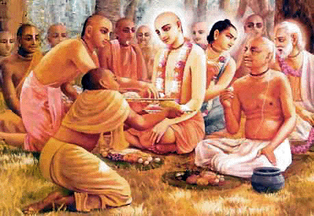 Traditional devotional painting of Sri Chaitanya Mahaprabhu seated among Shivananda Sena and other associates in a wooded setting, evoking the household scene in which the infant Kavi-karnapura received Mahaprabhu's blessing.