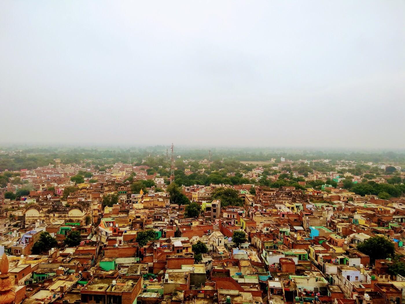 View over Barsana from the Shriji Temple, whose deity tradition says manifested through Narayana Bhatta Goswami's prayers, and whose priests still trace their line to his descendants.