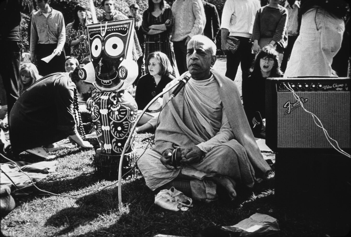 Srila Prabhupada leading outdoor kirtan in Golden Gate Park, San Francisco, February 1967, in the months just after ISKCON's founding, with young American followers gathered around him.