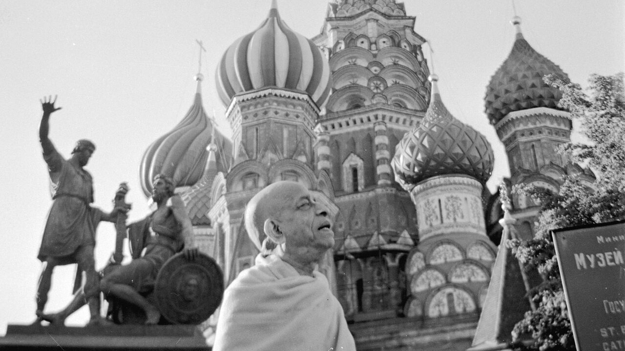 Srila Prabhupada walking across Red Square, Moscow, in front of St. Basil's Cathedral during his sole visit to the USSR, July 1971.