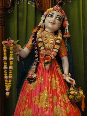 A second devotional Deity image of Tungavidya-gopi, holding flower garlands - the eternal identity in which Prabodhananda Saraswati, author of Sri Radha-rasa-sudha-nidhi, is said to serve Srimati Radharani in Goloka Vrindavana.