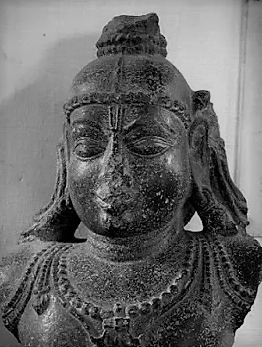 The surviving upper portion of a Bala Gopala deity carried away from the Udayagiri fort by invading Vijayanagara forces during Prataparudra's wars on his southern frontier.