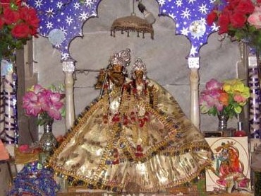 A Radha-Krishna Deity altar, of the kind Purushottama Thakura's family installed and carried from village to village for centuries as their shrines were repeatedly lost to the Ganges.