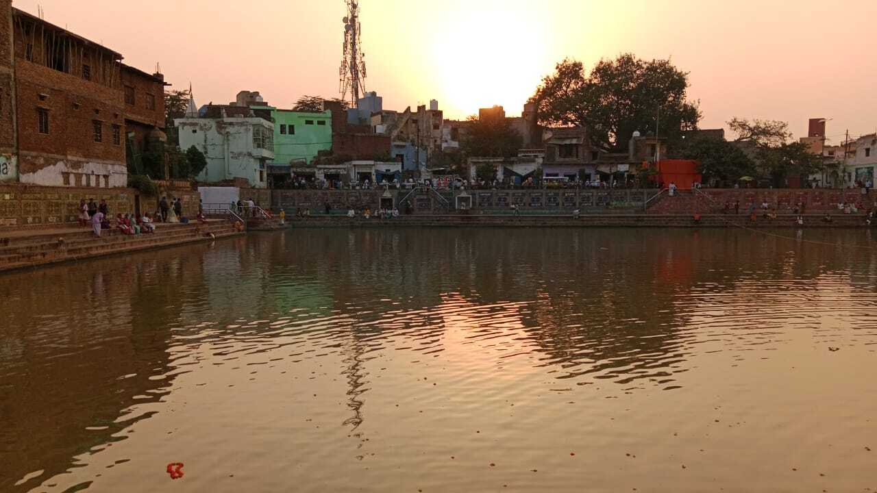 Evening at Radha-kunda, Vrindavana, where Raghunatha Bhatta Goswami's samadhi still stands and where pilgrims continue to visit in his memory.