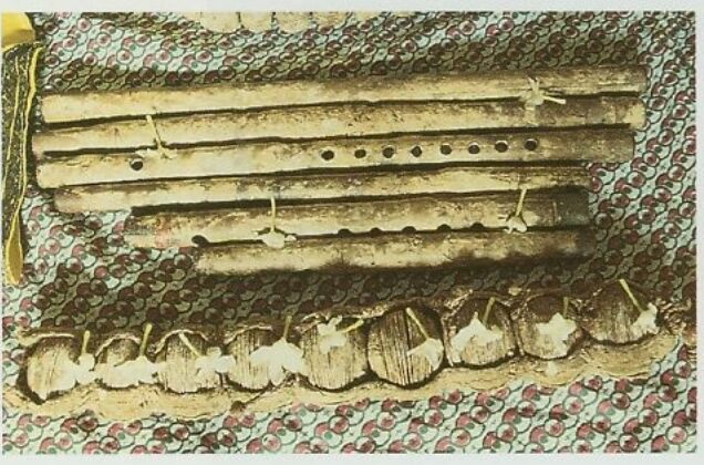 Close-up of preserved flutes and prayer beads said to have belonged to Shyamananda and Rasikananda Prabhu