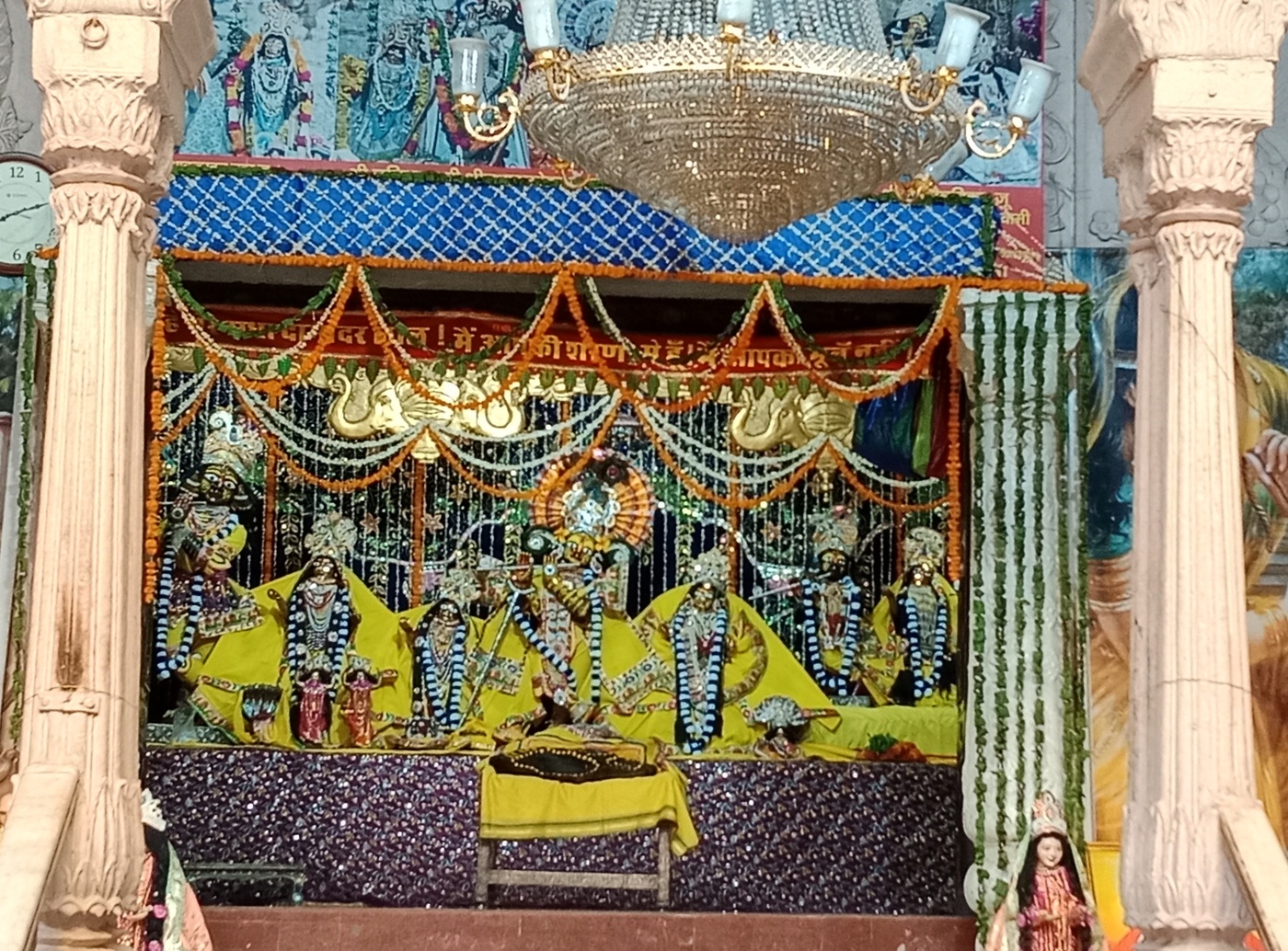 A photograph of the decorated deity altar inside the Radha-Damodara temple in Vrindavana, beside whose courtyard at Seva-kunja Rupa Gosvami's bhajana-kutir and samadhi are located.