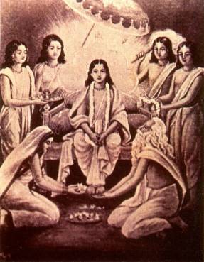 A traditional painting of Sri Chaitanya Mahaprabhu seated with His associates, including musicians performing kirtan and devotees worshipping His lotus feet -- captioned in its original source as depicting Narahari Sarakara Thakura fanning 
