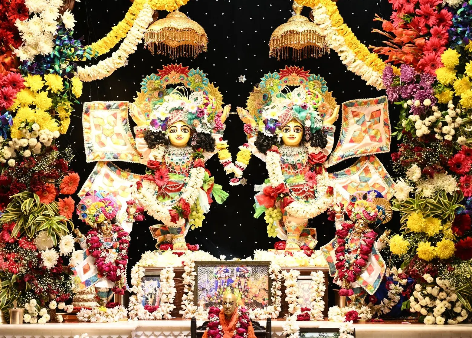 Sri Sri Krishna Balaram on a flower-decorated altar at Nandgram Dham